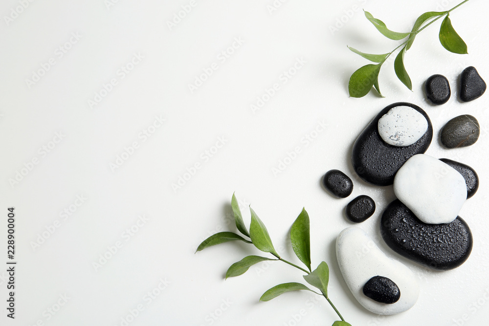 Flat lay composition with spa stones and space for text on white background - obrazy, fototapety, plakaty 