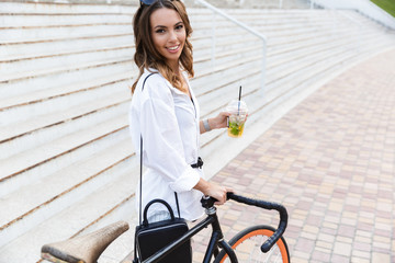 Poster - Cheerful young woman spending time at the park