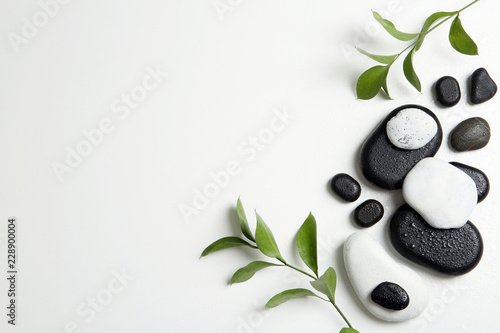 Flat lay composition with spa stones and space for text on white background Canvas Print