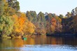 autumn landscape with boat in the lake and trees
