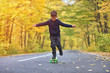 © Daniel CHETRONI - Kid skateboarder doing skateboard tricks in autumn environment