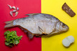 dried fish bream on red yellow background