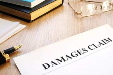 Poster - Damages claim form and pen. Insurance concept.