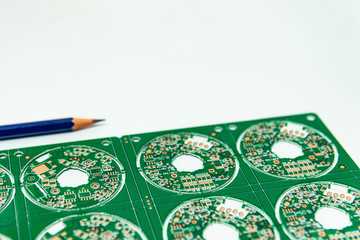 Electronic product design concept,printed circuit board(PCB) include pencil 2B with isolated white background,PCB