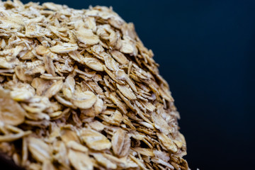 Poster - Hill of oatmeal on a white background.