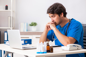 Young doctor working in the hospital