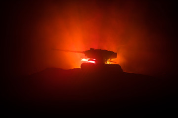 War Concept. Military silhouettes fighting scene on war fog sky background, World War German Tanks Silhouettes Below Cloudy Skyline At night. Attack scene. Armored vehicles. Tanks battle