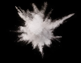 White powder explosion on black background