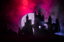 Mysterious Medieval Castle In A Misty Full Moon. Abandoned Gothic Style Old Castle At Night
