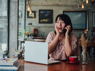 Asian woman drinking coffee and relax in coffee shop cafe