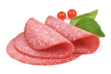 Traditional salami slices with basil leaves and Physalia berry. Isolated on a white background, Close-up.