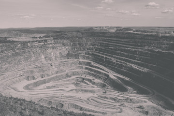 Wall Mural - Aerial view industrial of opencast mining quarry with lots of machinery at work - view from above. Extraction of lime, chalk, calx, caol