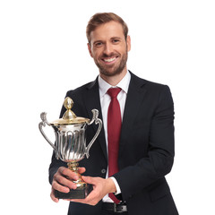 Poster - portrait of joyful businessman offering the cup