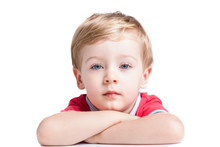 Portrait Of Adorable Little Boy Looking To The Camera, Isolated On White Background