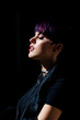 © Carlos David - Profile portrait of a stylish fashion model with short purple hair and pink lips