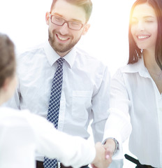 Sticker - young business woman shaking hands with a colleague