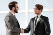 © ASDF - two business people shaking hands