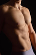 © Curto - naked body of a man on black background