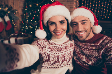 Canvas Print - Winter christmastime concept. Handsome man and brunette beautifu