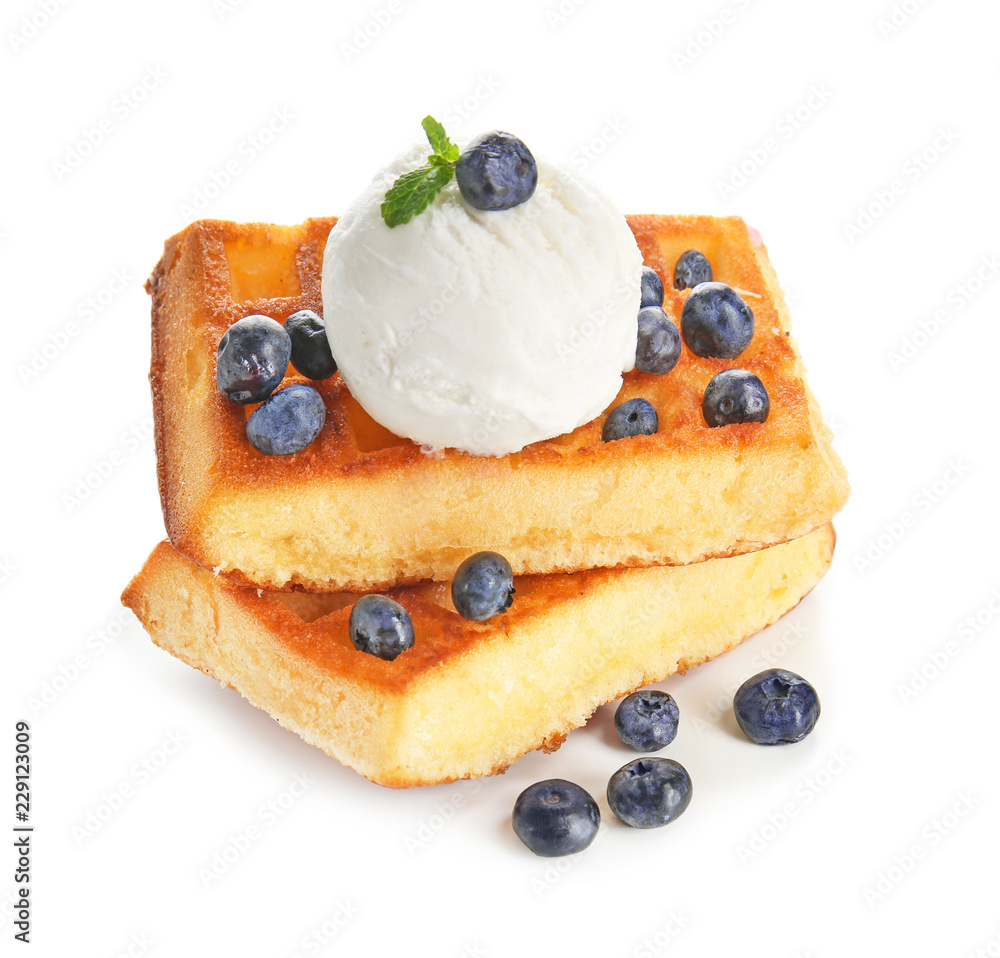 Delicious waffles with blueberries and ice cream on white background