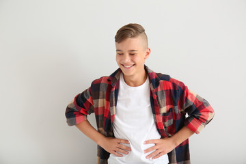 Laughing teenage boy on white background