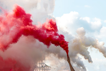 smoke bomb in hand