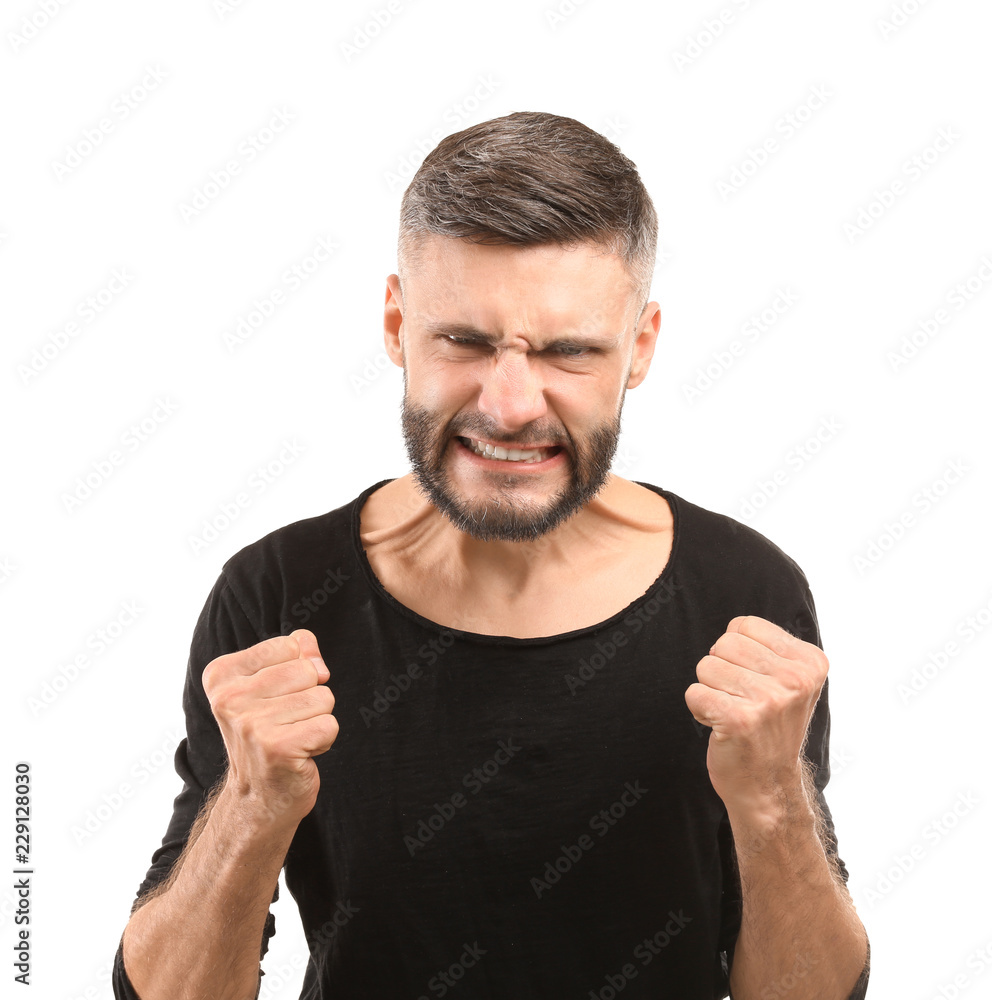Portrait of aggressive man on white background