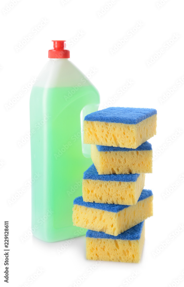 Bottle of detergent with cleaning sponges on white background