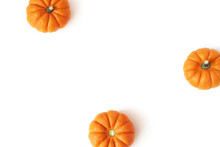 Autumn Frame Made Of Little Orange Pumpkins Isolated On White Table Background. Fall, Halloween And Thanksgiving Concept. Styled Stock Flat Lay Photography. Top View. Empty Space For Text. Vegetable.