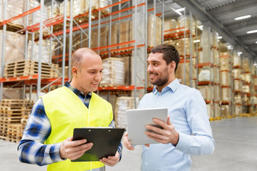 Poster - wholesale, logistic business and people concept - warehouse worker and businessman with clipboard and tablet pc computer