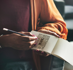 Wall Mural - woman drawing creative ideas on a notepad