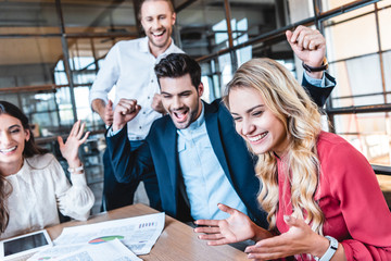 Wall Mural - happy successful business team at workplace in office