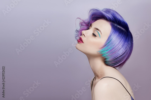 portrait-of-a-woman-with-bright-colored-flying-hair-all-shades-of-purple-hair-coloring-beautiful-lips-and-makeup-hair-fluttering-in-the-wind-sexy-girl-with-short-hair-professional-coloring