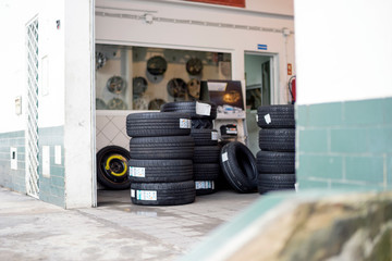 Entrance to car mechanic place with tires