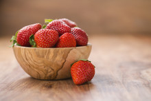 Fresh Ripe Strawberries In Wood Bowl On Table