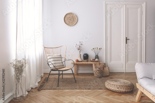 Sheer White Curtains On The Window Of A White Living Room