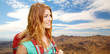 © Syda Productions - adventure, travel, tourism, hike and people concept - smiling young woman with backpack over grand canyon national park hills background