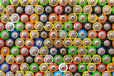 Fototapeta Młodzieżowe - Many used batteries and accumulators, color background