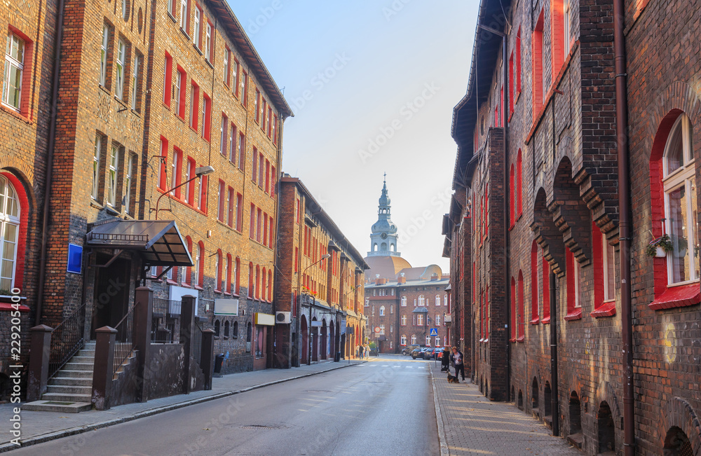 Obraz na płótnie Street in the Historic Mining District of Nikiszowiec in Katowice in Polish Silesia. The street is adjoined by  red-brick houses in which the miner's family lived w salonie