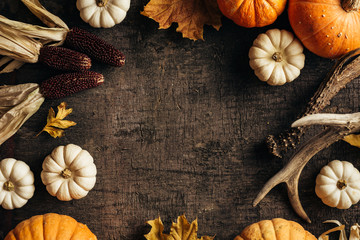 Wall Mural - autumn background with pumpkins, colourful leaves and festive decoration. top view. copy space.