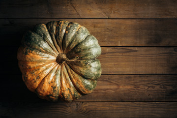 Wall Mural - large pumpkin on wooden background