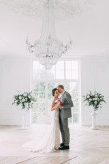 Wall Mural - Stylish wedding in St. Petersburg. Russian wedding in European style in the Studio. Fine art in photography.