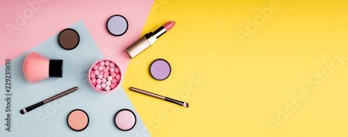 Fotografía Makeup products and decorative cosmetics on color background flat lay