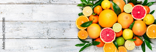 Fotografía Fresh citrus fruits background