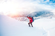 © zhukovvvlad - A man in snowshoes in the mountains.