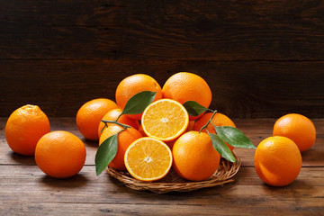 Poster - fresh orange fruits on wooden table