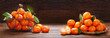 Fresh mandarin oranges fruit or tangerines on wooden table