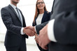 © ASDF - Business shaking hands in the office
