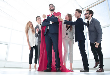 Wall Mural - boss is a superhero and the business team is standing together