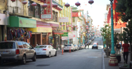 Naklejka na meble Defocused background of Chinatown district with Chinese lanterns and tourists